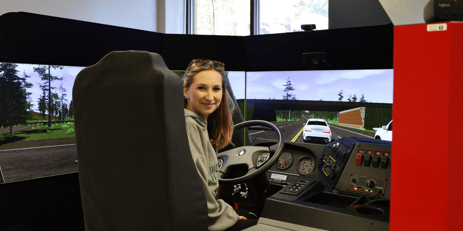 female student in an emergency vehicle simulator