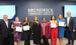 manicurist graduates with instructors and staff