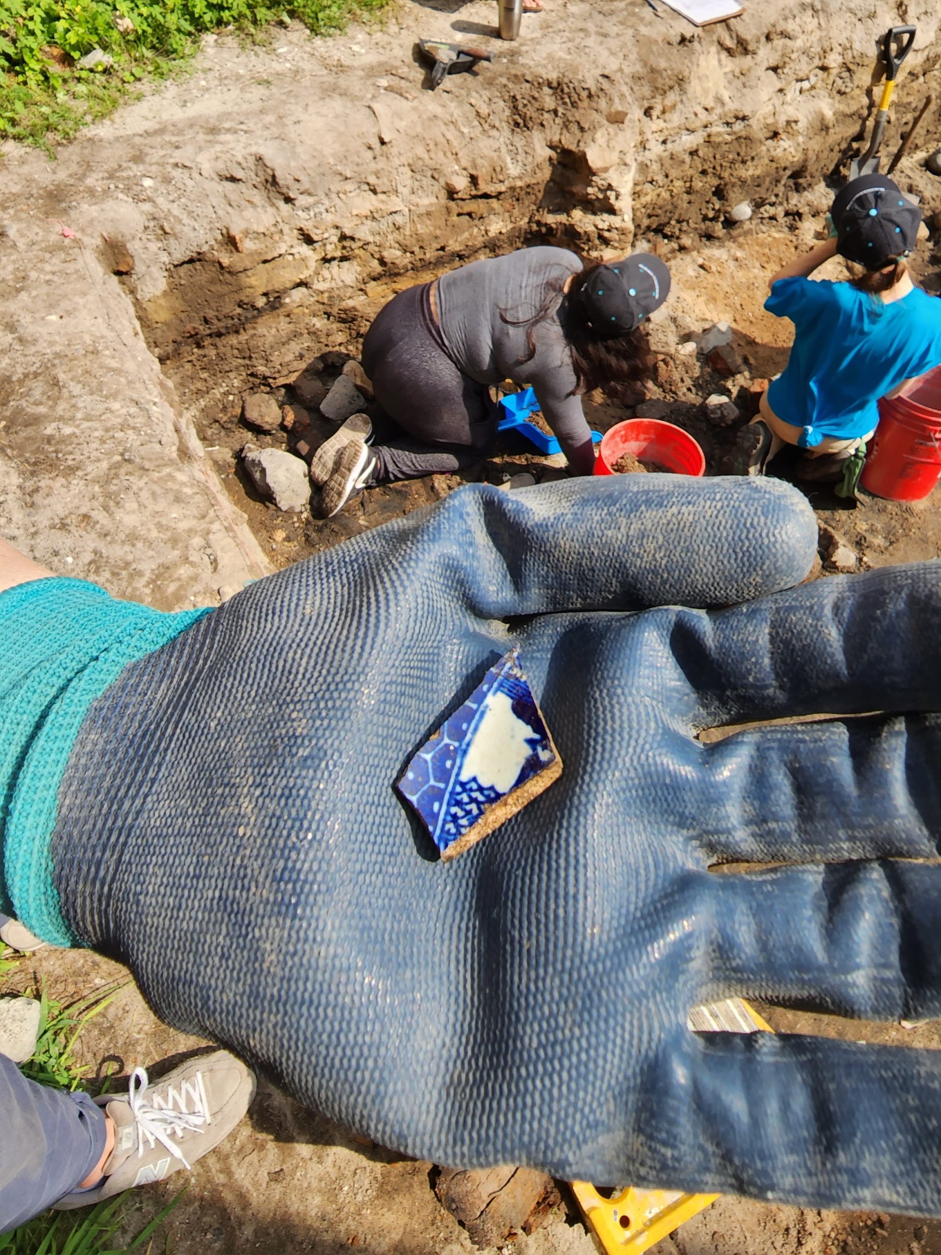 BCC instructor and students at an offsite field trip to an archeological dig