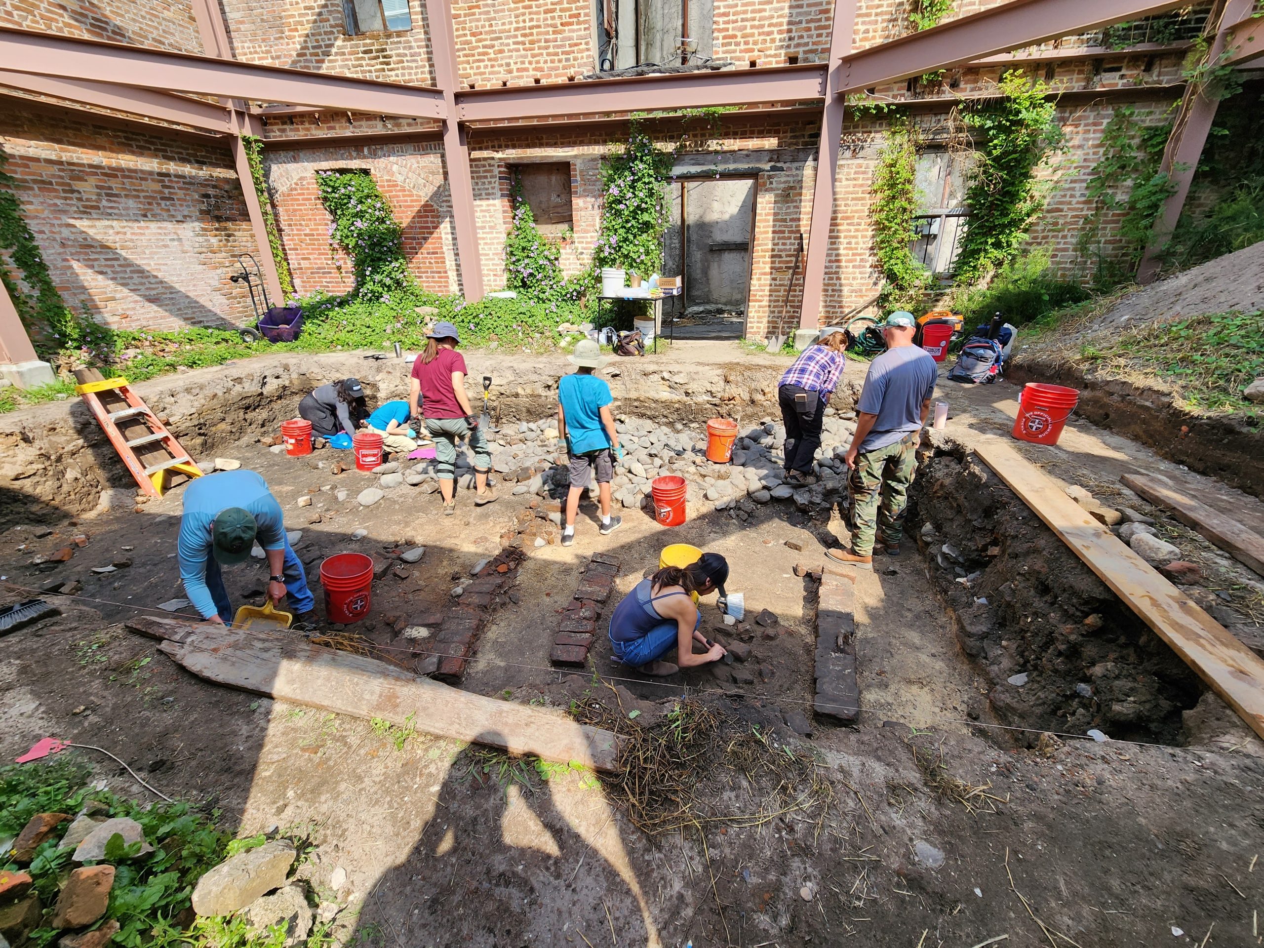 BCC instructor and students at an offsite field trip to an archeological dig