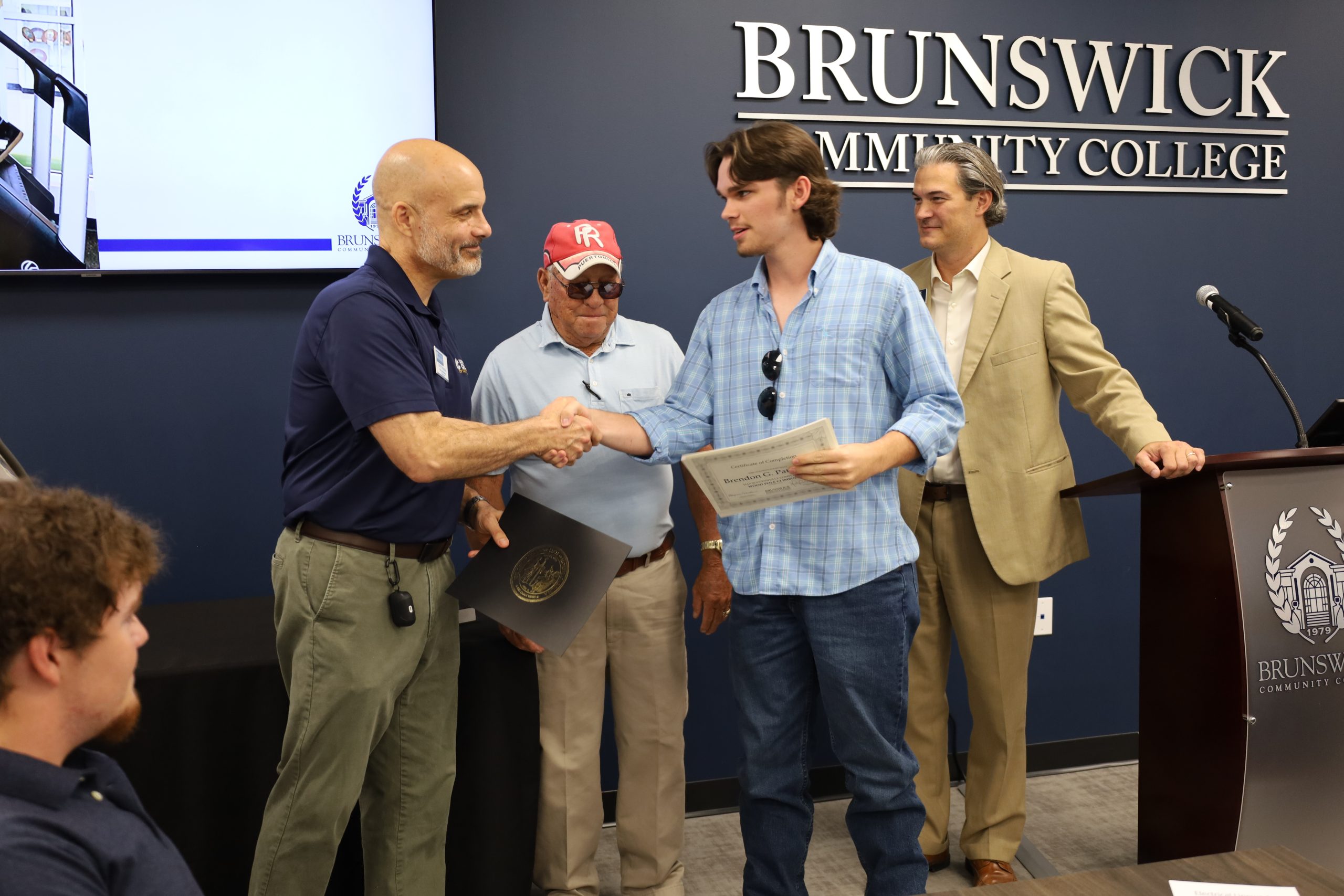 Photo of student at Lineworker graduation ceremony