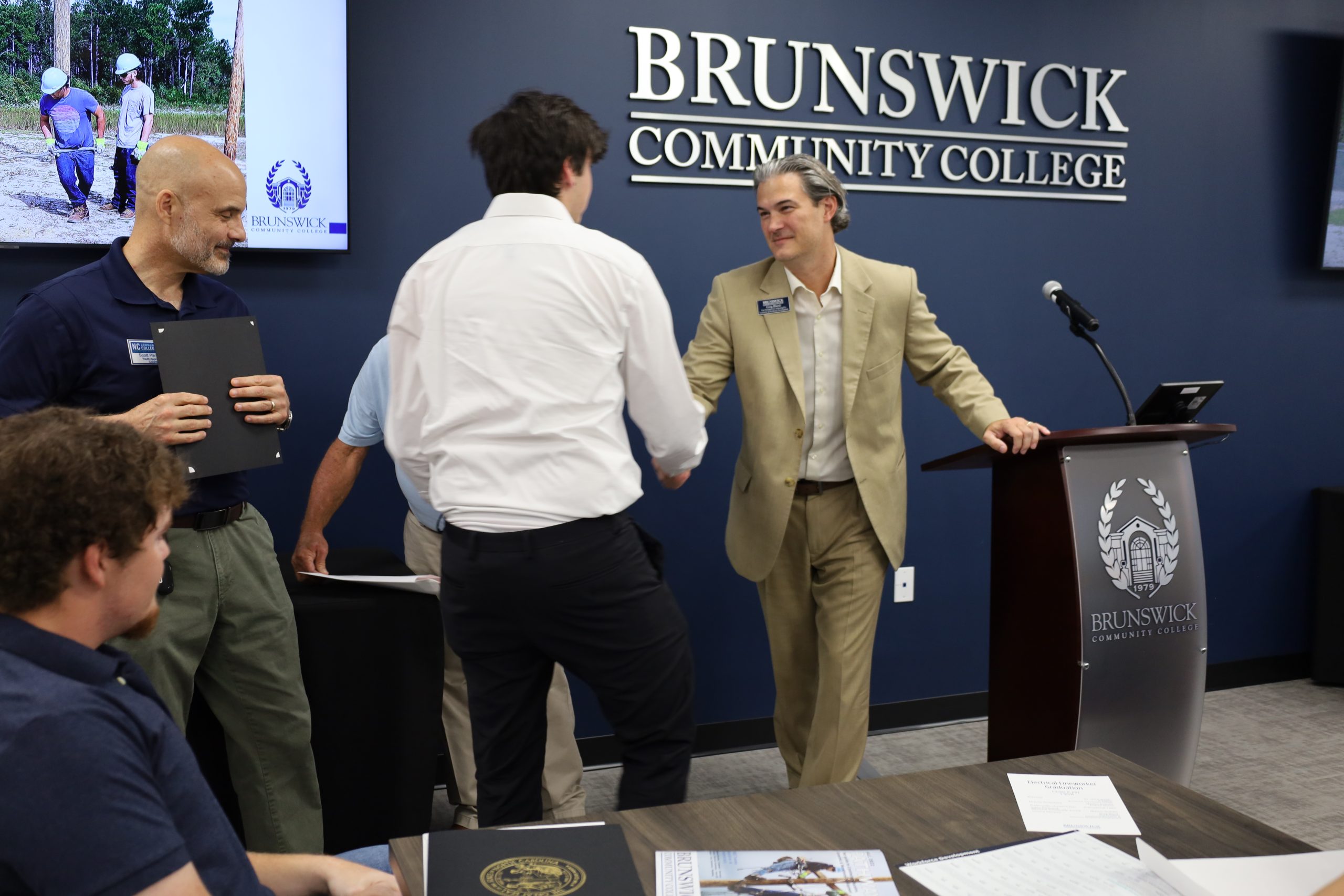 Photo of student at Lineworker graduation ceremony