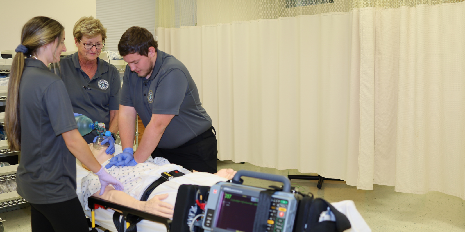 EMT students working on a patient