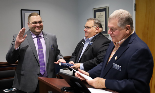 Zachary Hewett takes the Oath of Office as a new BCC Trustee