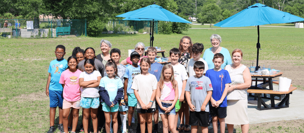 Group photo of children, donors, and staff at the dedication of the Donna Mandell Creativity Cove at BCC's Southport Center