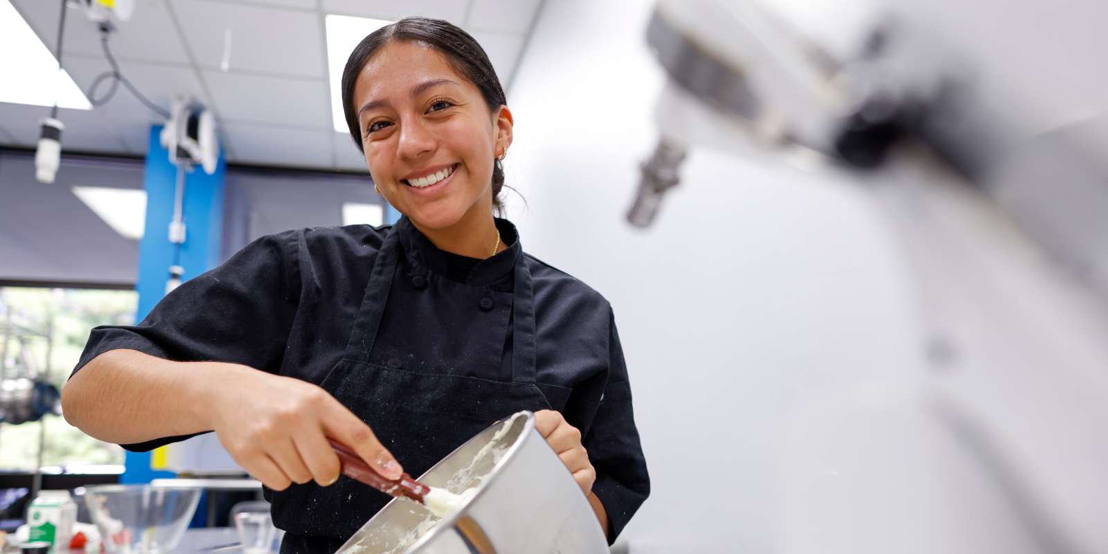 CULINARY STUDENT STIRRING BATTER