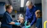 Instructor and three paramedics in ambulance