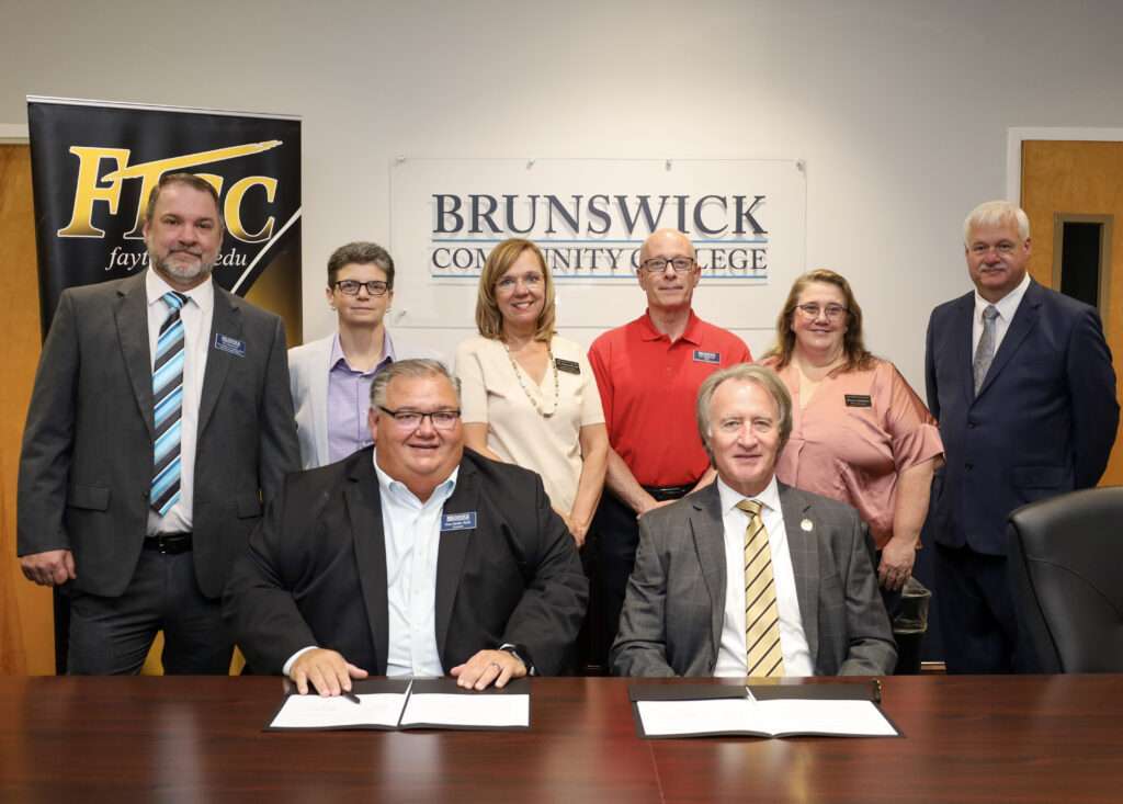 The presidents of BCC and FTCC with staff after signing an agreement for a Funeral Services program