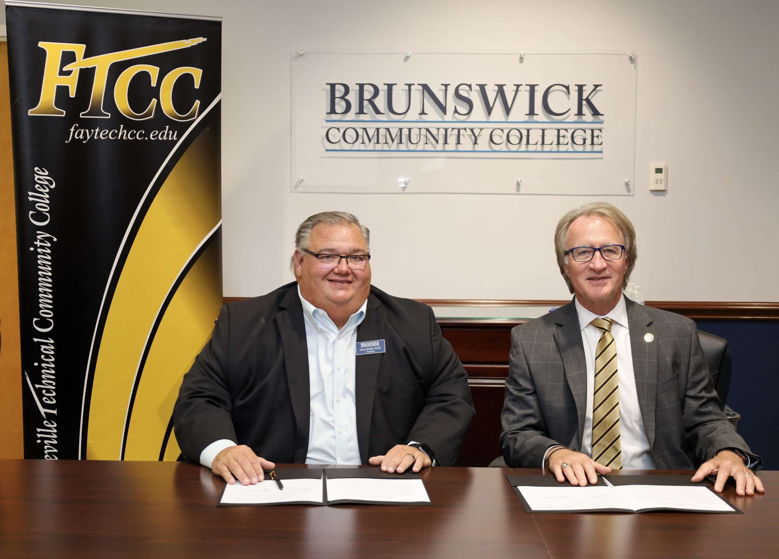 The presidents of BCC and FTCC posing for a photo after signing an agreement for a Funeral Services program