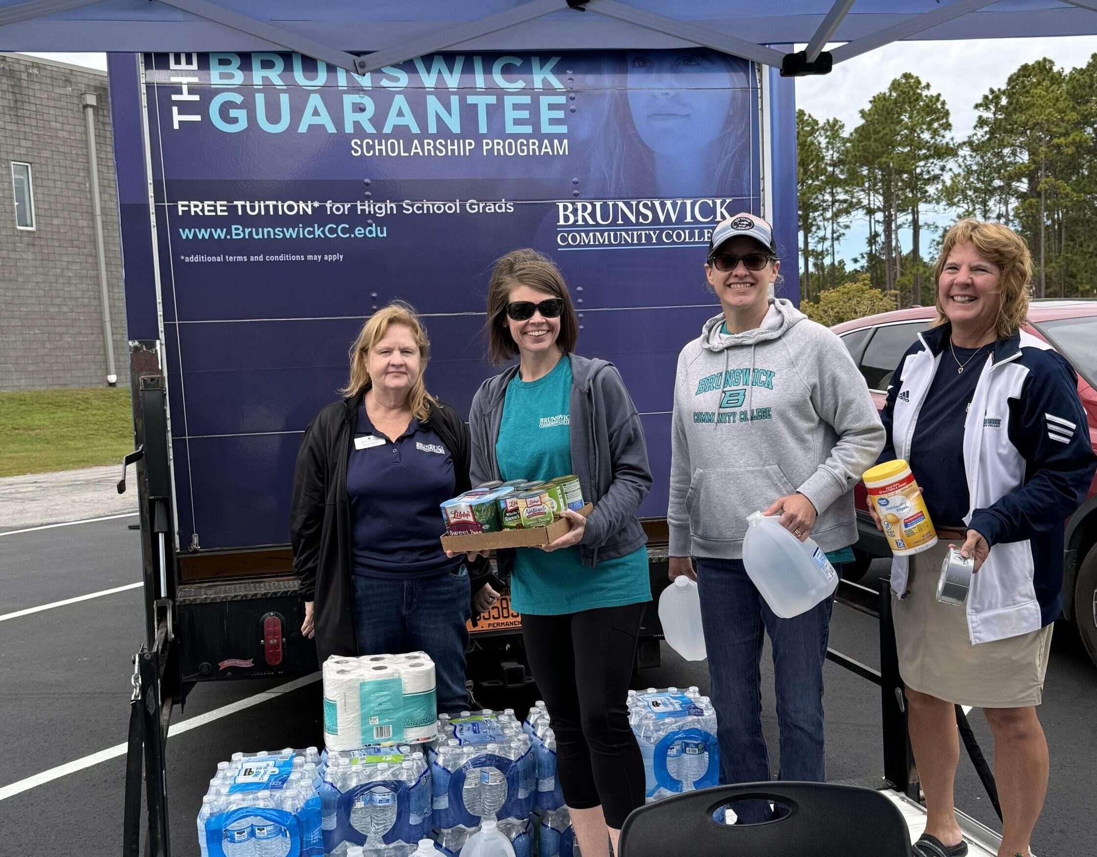 Foundation Executive Director and employee volunteers staffing the Relief Drive for Western NC