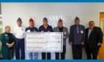 A check presentation photo with BCC Foundation, Leadership, and members of 40 & 8.