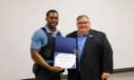 Demetrius Greene and President Gene Smith at Student of the Month presentation