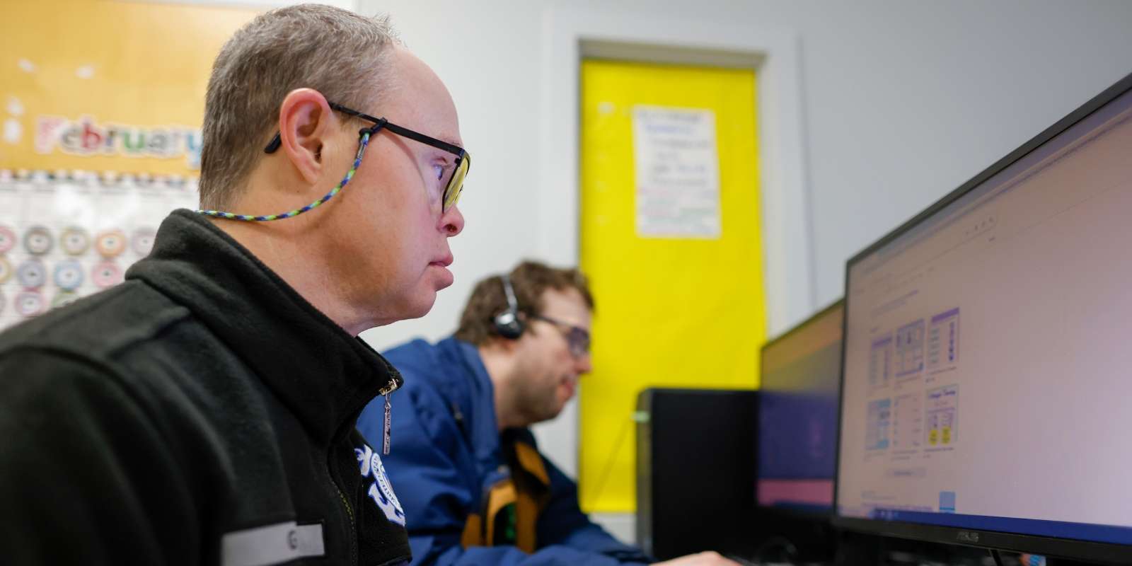 Two BIP students in computer class