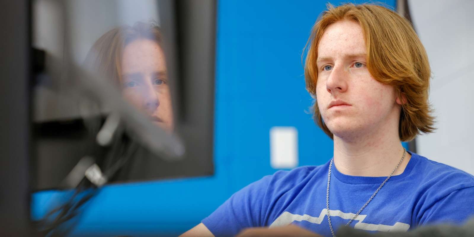 University transfer student listening intently in class