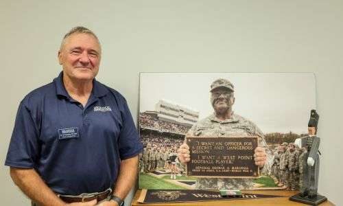 Ed Naessens in a BCC polo shirt smiling at the camera