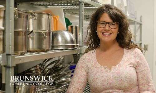 Coordinator of Culinary Arts Lauren McCoy smiling at the camera