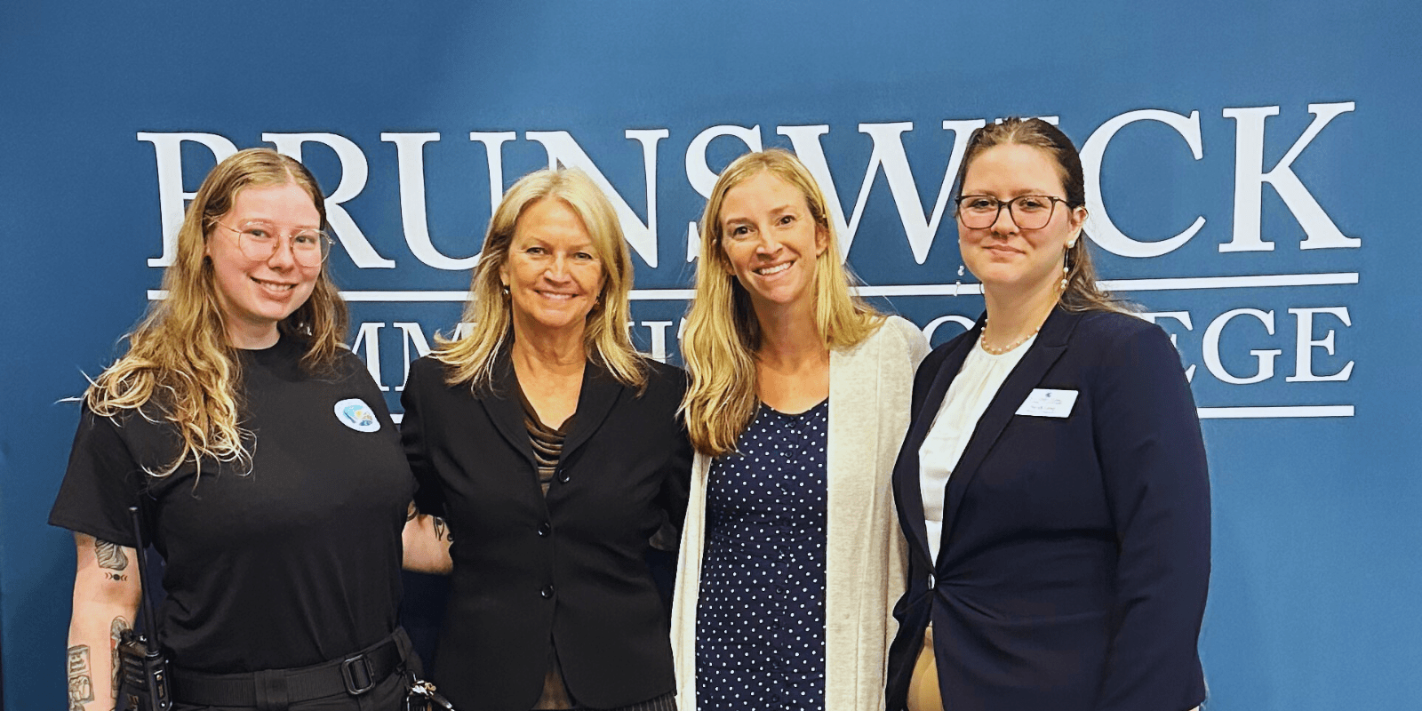 Four women smiling at the camera