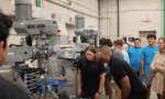 high school students exploring machining lab