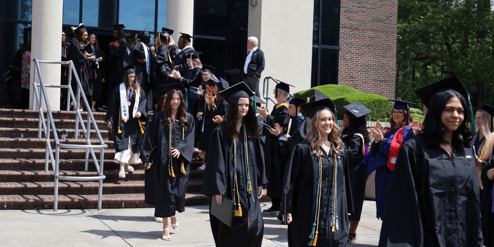 Students exiting graduation ceremony