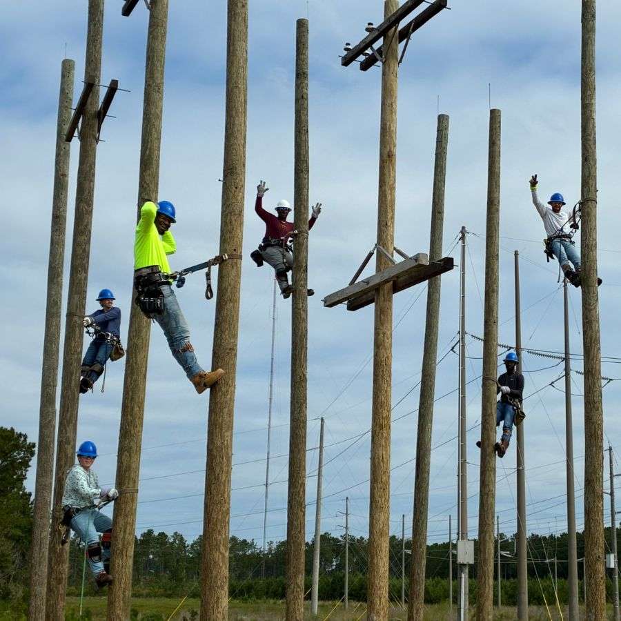 Lineworkers on poles
