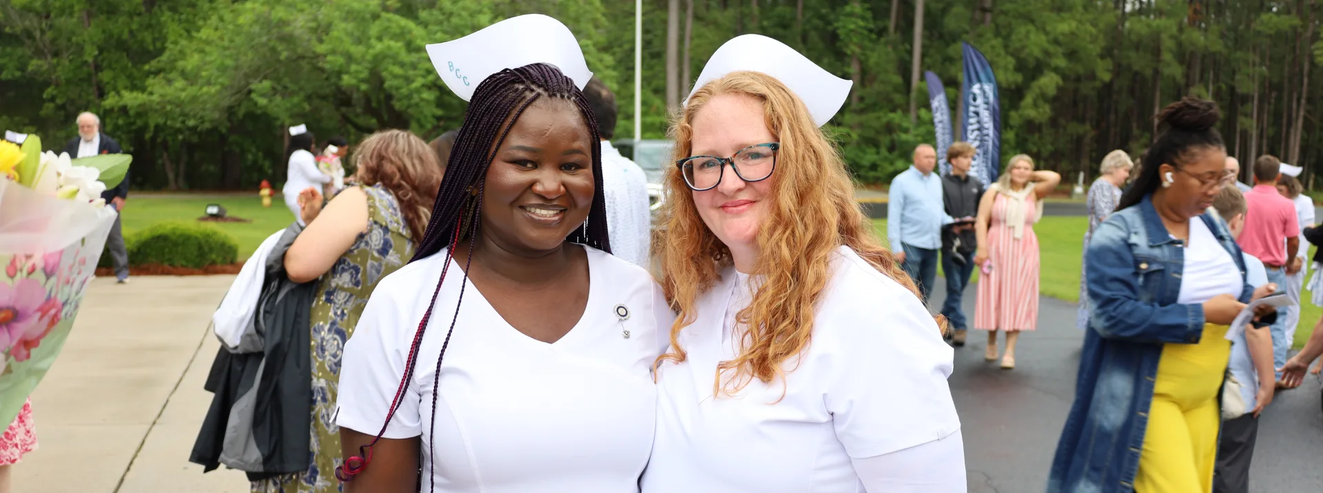 two nurses looking at the camera