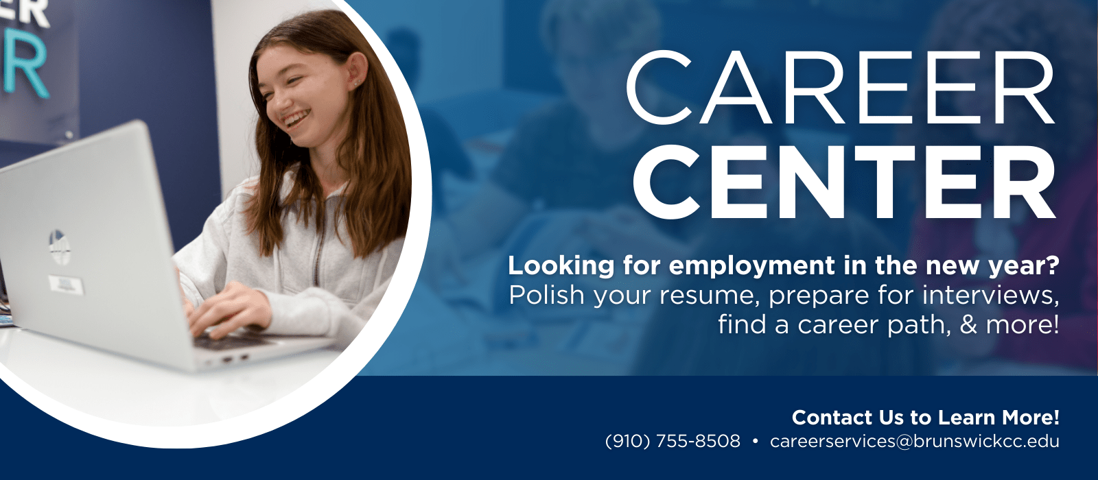 Smiling female student working on laptop