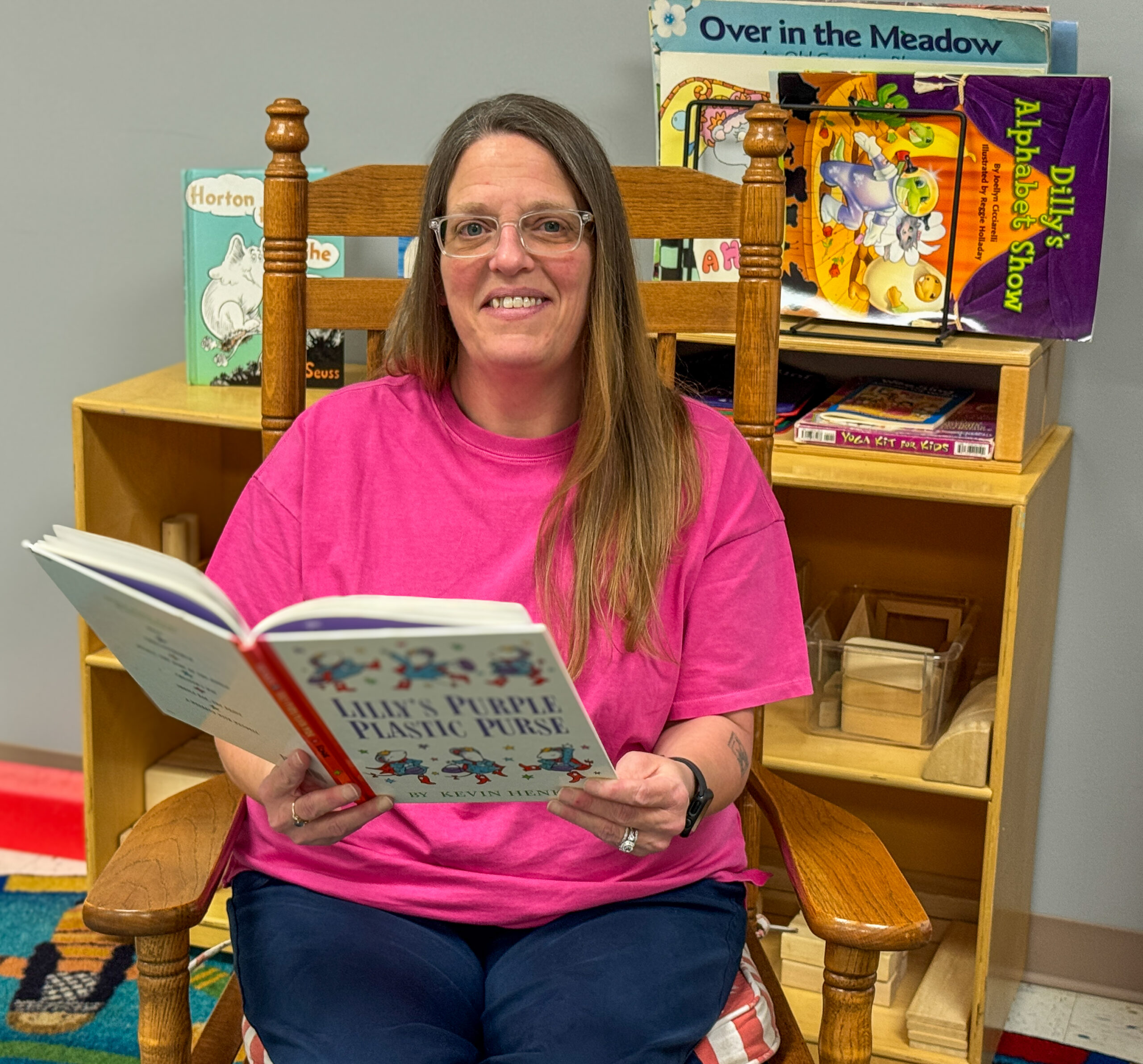Female student holding a story book