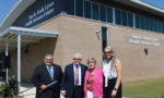 President Gene Smith, Dan and Linda Lynes, and Katie Caison at ribbon cutting