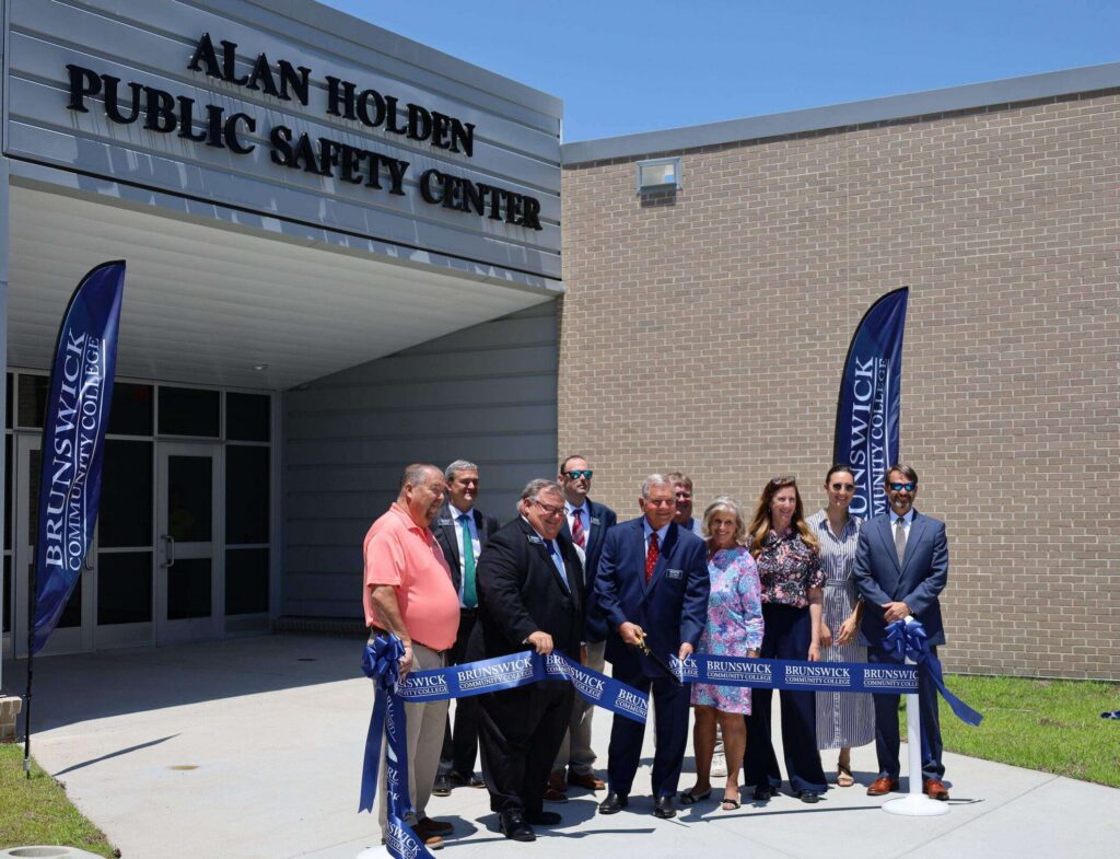 People participating in a ribbon cutting