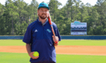 New softball coach on pitcher's mound