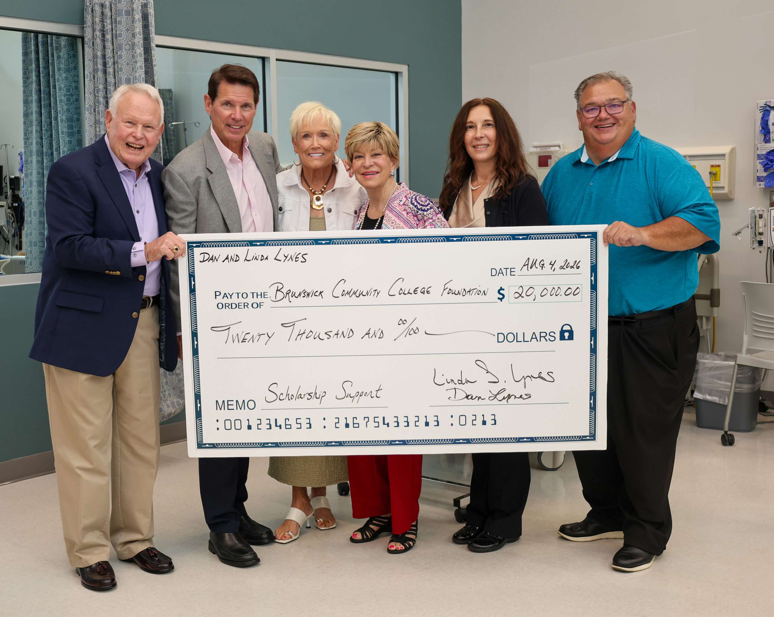 Dan and Linda Lynes presenting a check to The Foundation of BCC in support of scholarships for healthcare students